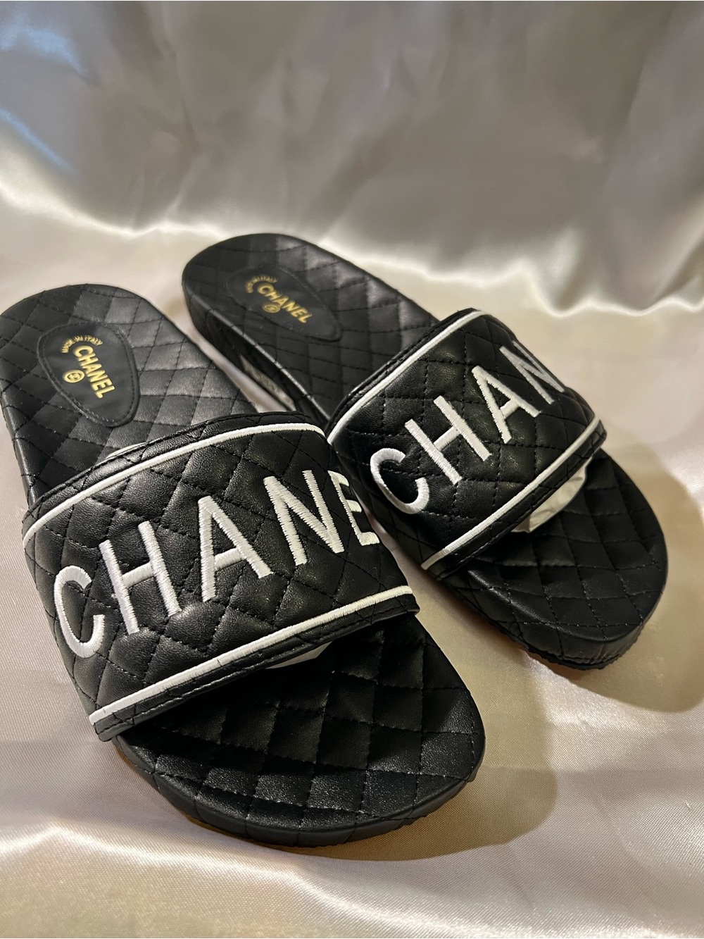 Black Quilted Logo Slides with White Trim. New
